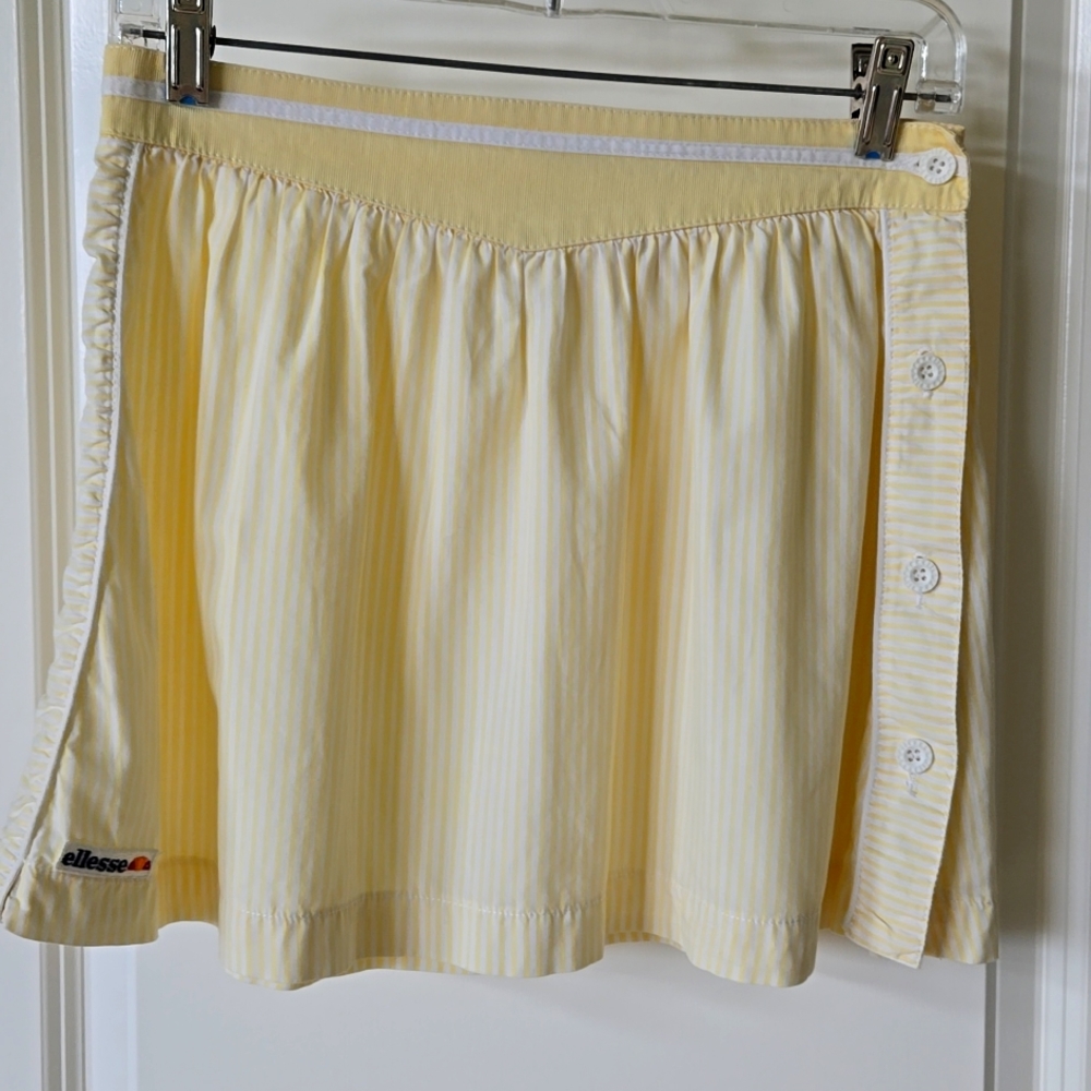 Vintage Ellesse tennis skirt. Yellow and white stripe, side buttons, cotton